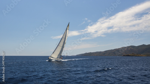 Sailing in the wind through the waves at the Sea. © De Visu