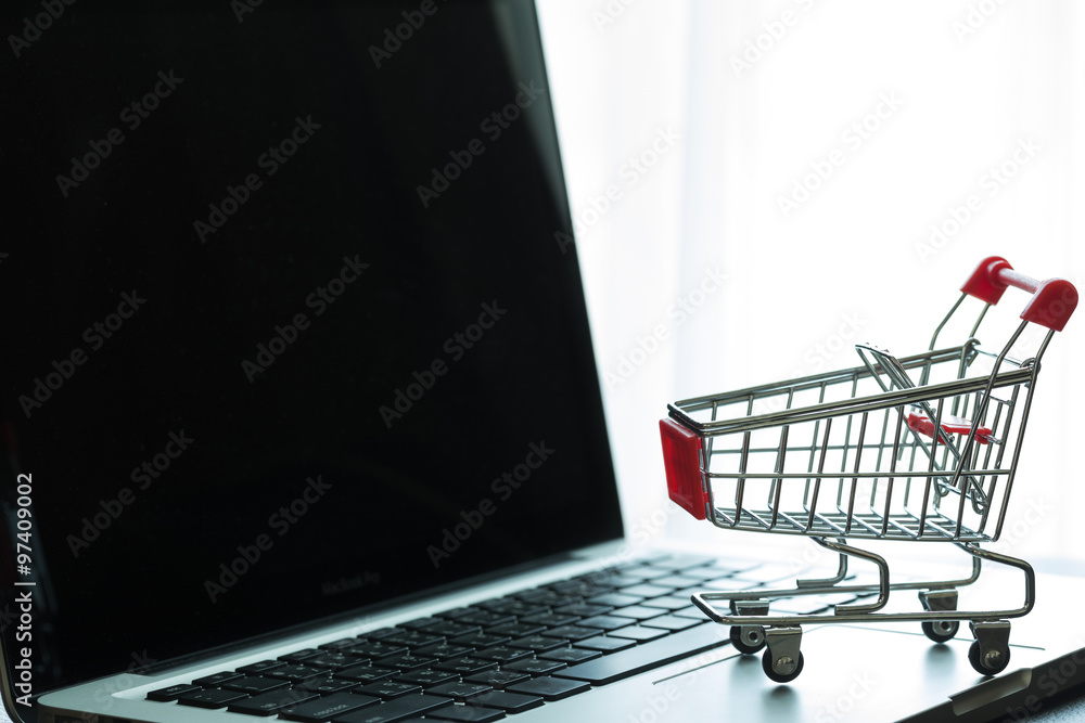 Mini Red Shopping Cart On Laptop : Online Shopping Concept