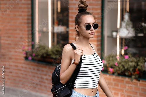 Fashion hipster cool girl in sunglasses.