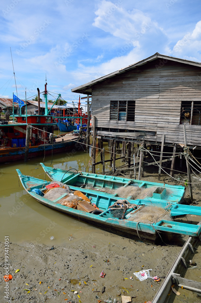 Obraz premium Colorful chinese fishing boat resting at a Chinese Fishing Village- Sekinchan, Malaysia..