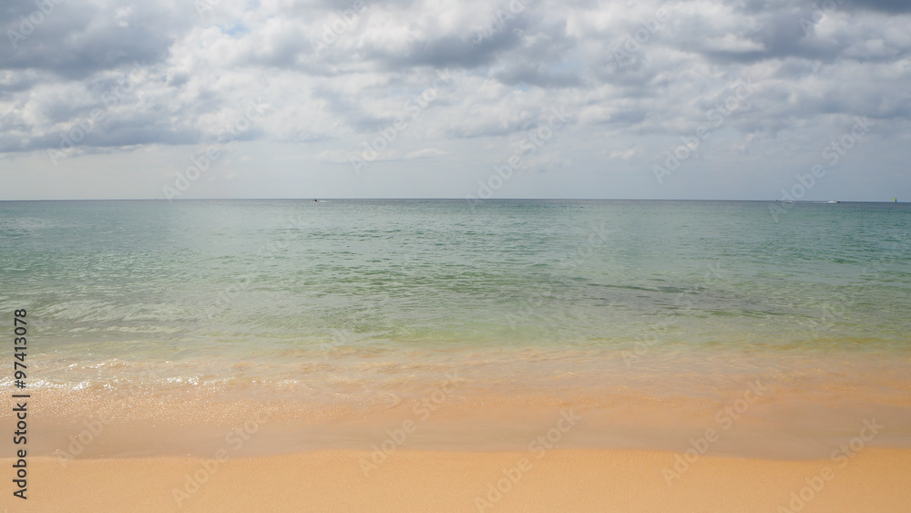 Summer photo of beach sea wave sand sky and clouds at tropical sea. Kata beach, Phuket Island, Thailand