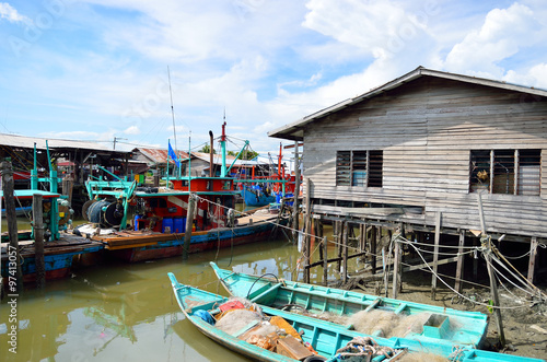 Colorful chinese fishing boat resting at a Chinese Fishing Village- Sekinchan, Malaysia..