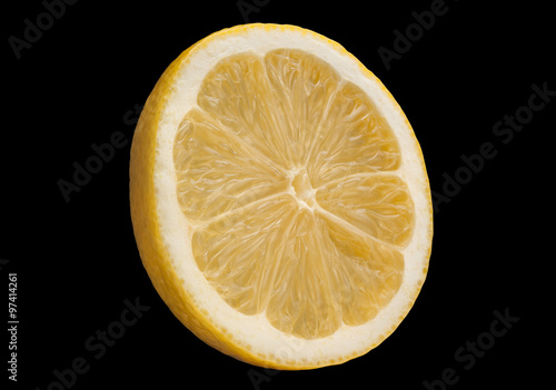 Lemon citrus fruit slice on black