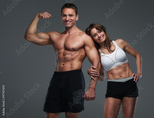  Muscular guy and slim attractive woman.