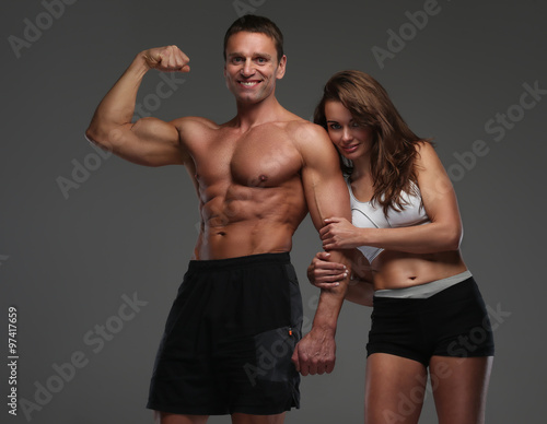  Muscular guy and slim attractive woman.
