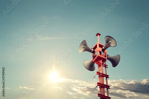 Tableau sur toile Horn speaker for public relations sign symbol, vintage color - sun with blue sky