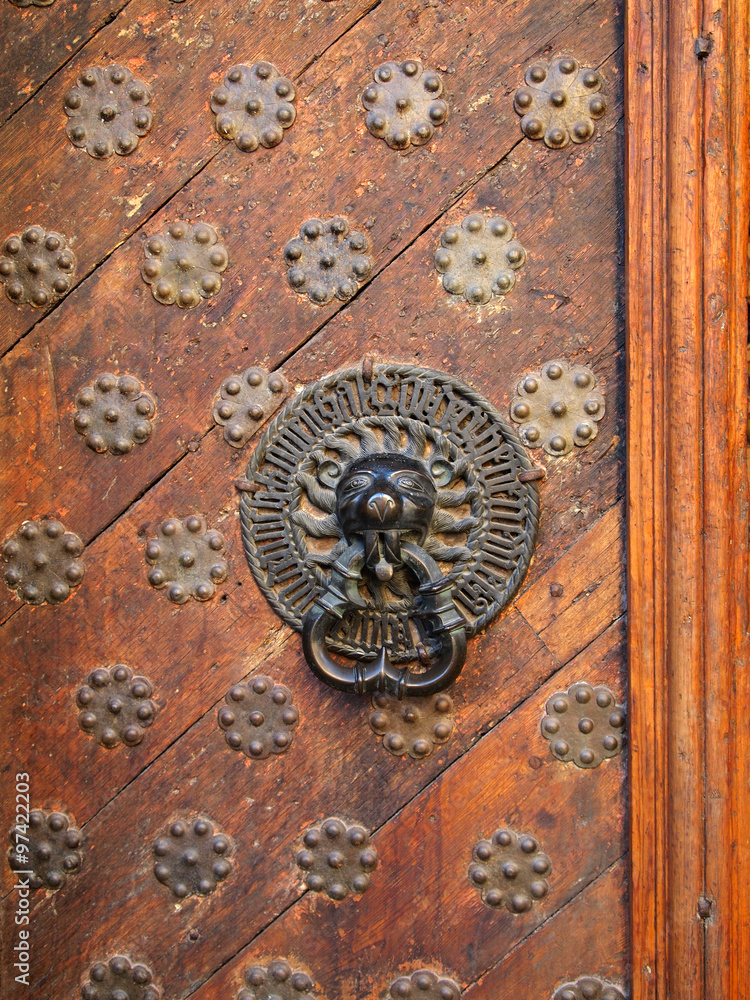Old-fashioned door with doorhandle