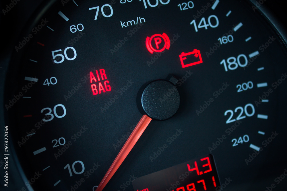 Airbag warning light. Car dashboard in closeup Airbag warning light. Car dashboard in closeup