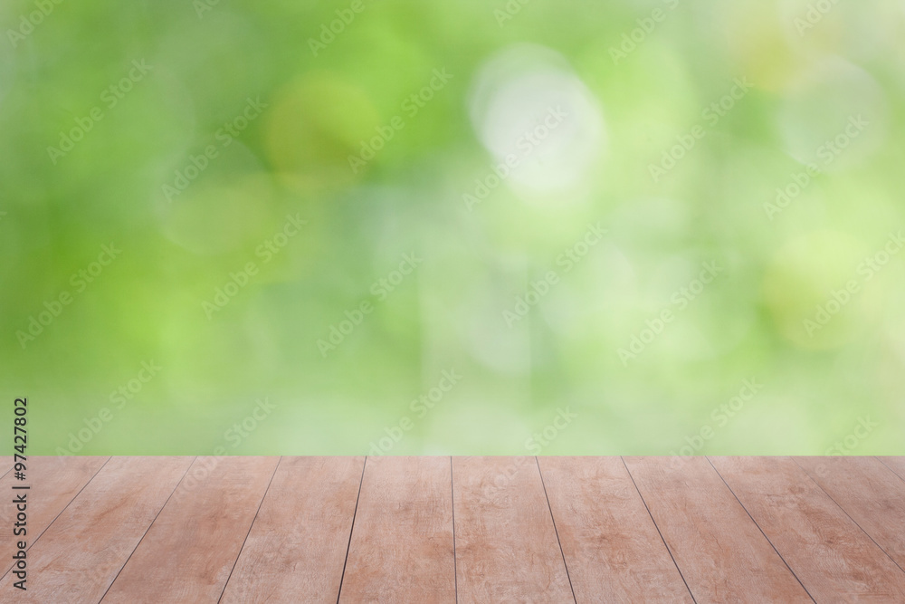 Wood table top on green bokeh abstract background. ready for product display Wood table top on green bokeh abstract background. ready for product display