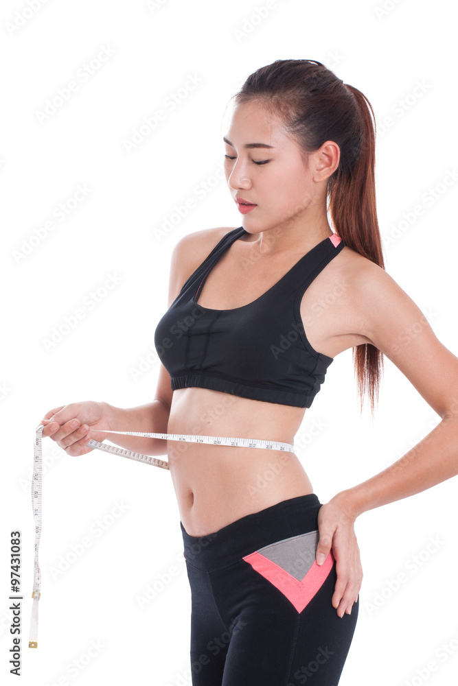 Fitness young woman taking measurements of her body. healthy concept Fitness young woman taking measurements of her body. healthy concept