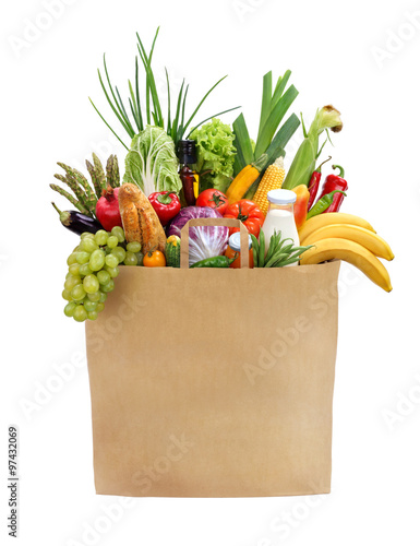 Full grocery bag / studio photography of brown grocery bag with fruits, vegetables, bread, bottled beverages - isolated over white background. High resolution product