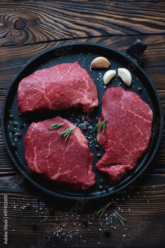 Photography Frying pan with fresh uncooked marbled beef steaks