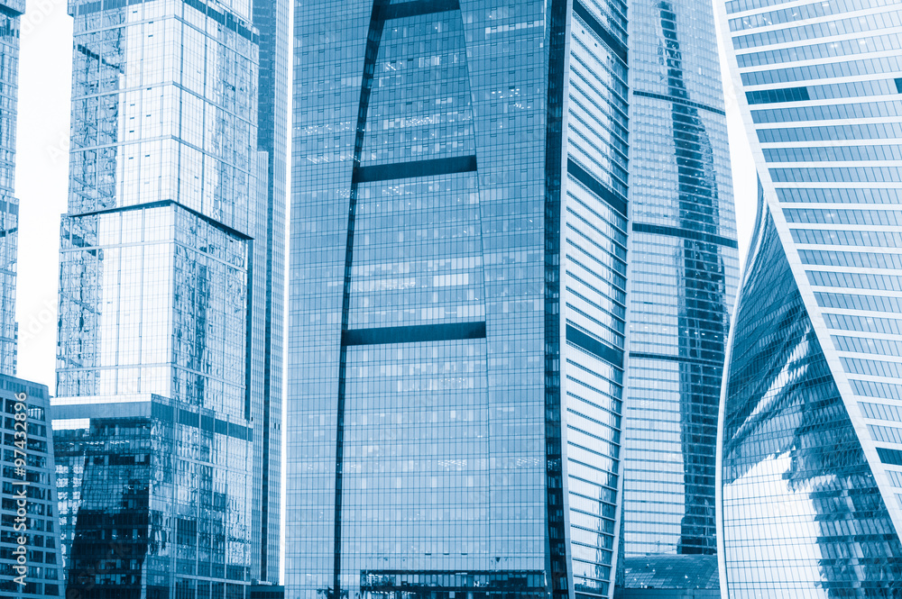 Fototapeta premium Office building in business center on a background closeup. Tone
