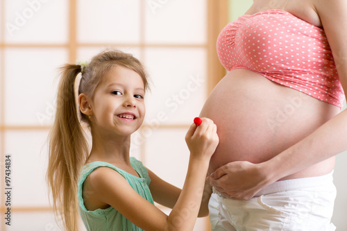 Cute little girl  paints on...