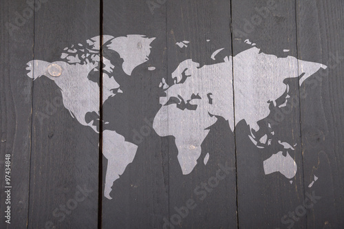 Fotografie World map on dark black wooden background