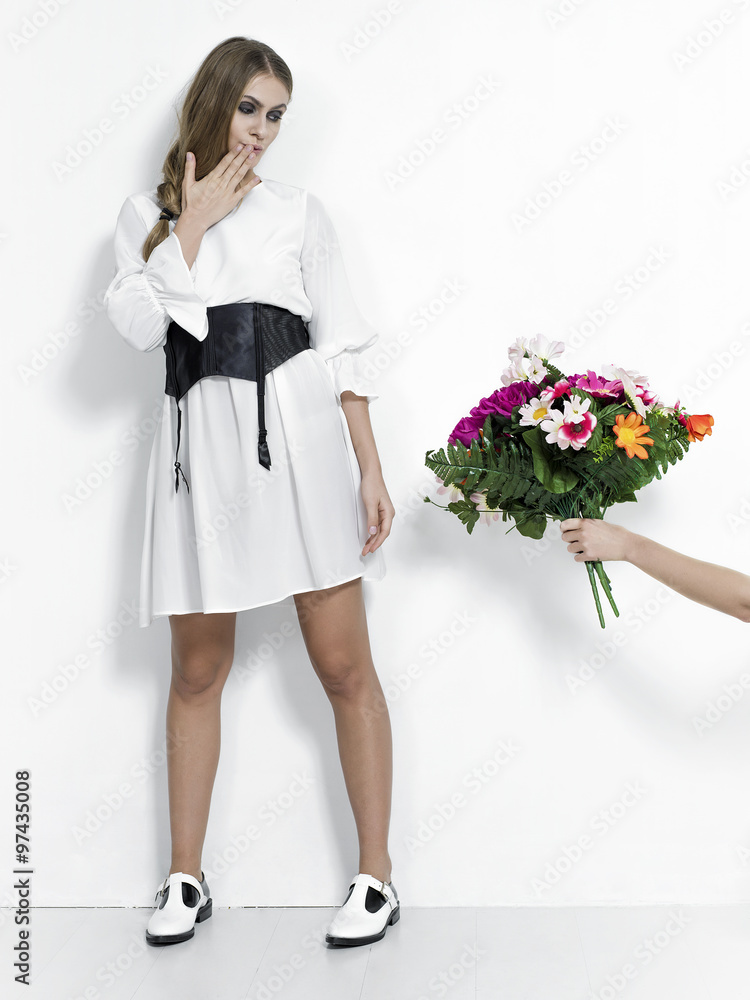 Surprised woman portrait being offered a bunch of flowers Surprised woman portrait being offered a bunch of flowers