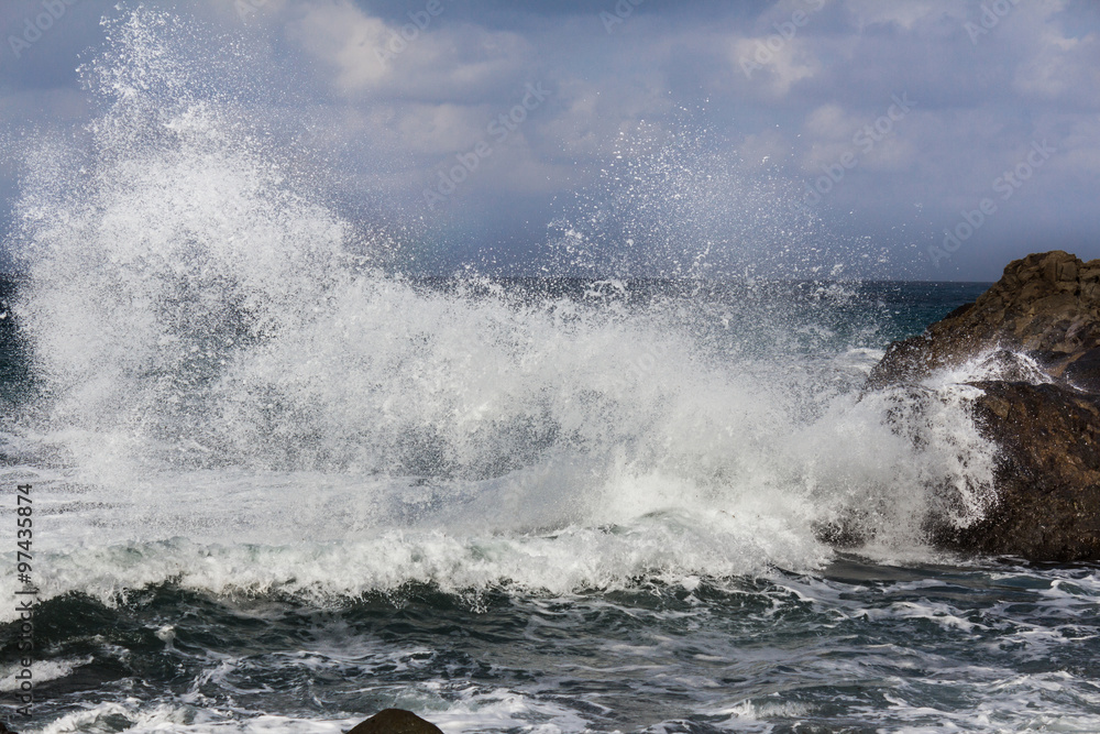 big waves breaking on shore - wave splashing on rock