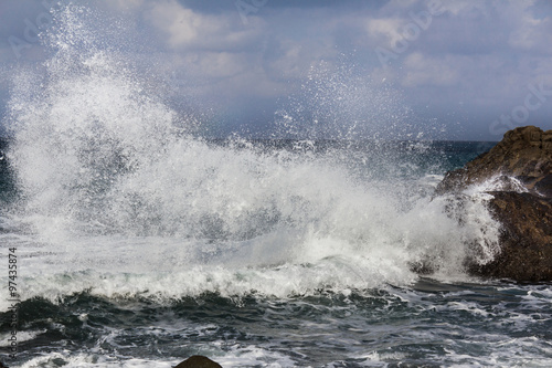 big waves breaking on shore - wave splashing on rock