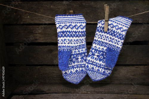 Jacquard mittens hanging on a rope