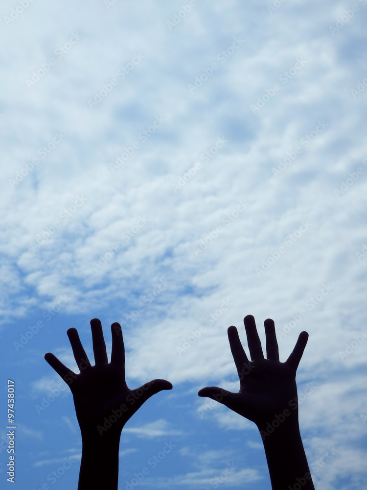 hands silhouettes and blue sky
