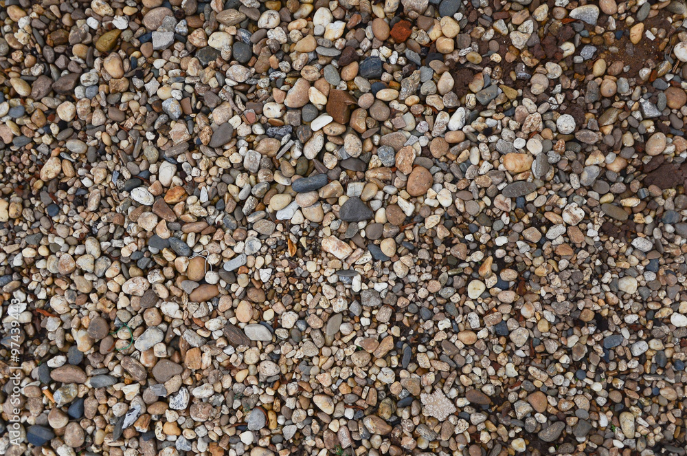 Crushed granite and pebble gravel texture with earth tone colorful Crushed granite and pebble gravel texture with earth tone colorful