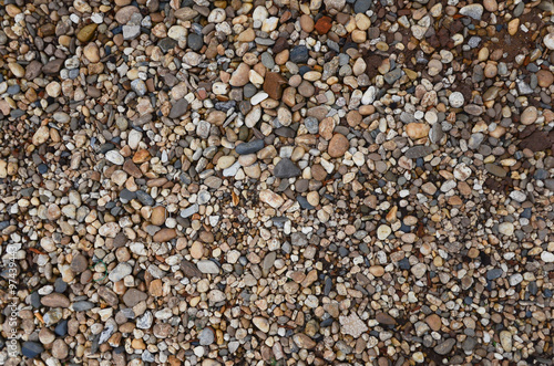 Crushed granite and pebble gravel texture with earth tone colorful