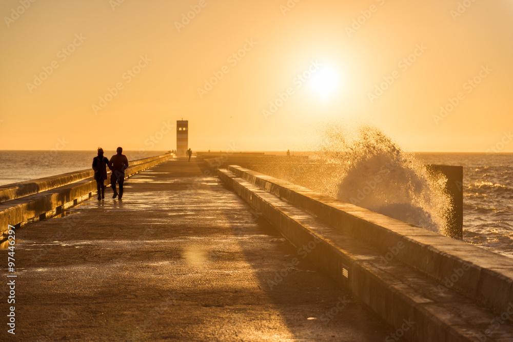Fototapeta premium Couple walking on sunset light