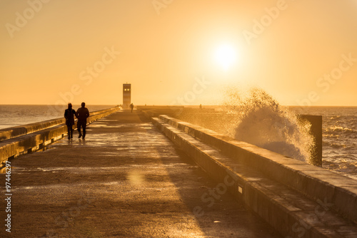 Couple walking on sunset light