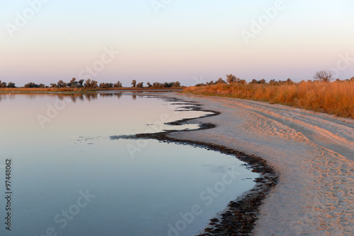 Colourful sunset over a wild beach near water