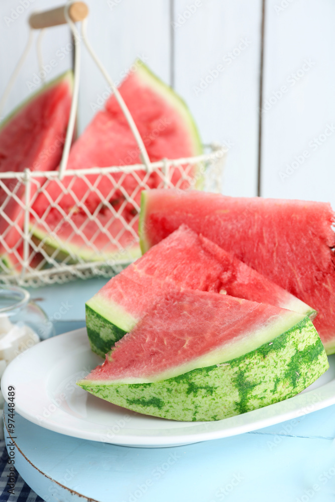 Sliced watermelon on white plate Sliced watermelon on white plate
