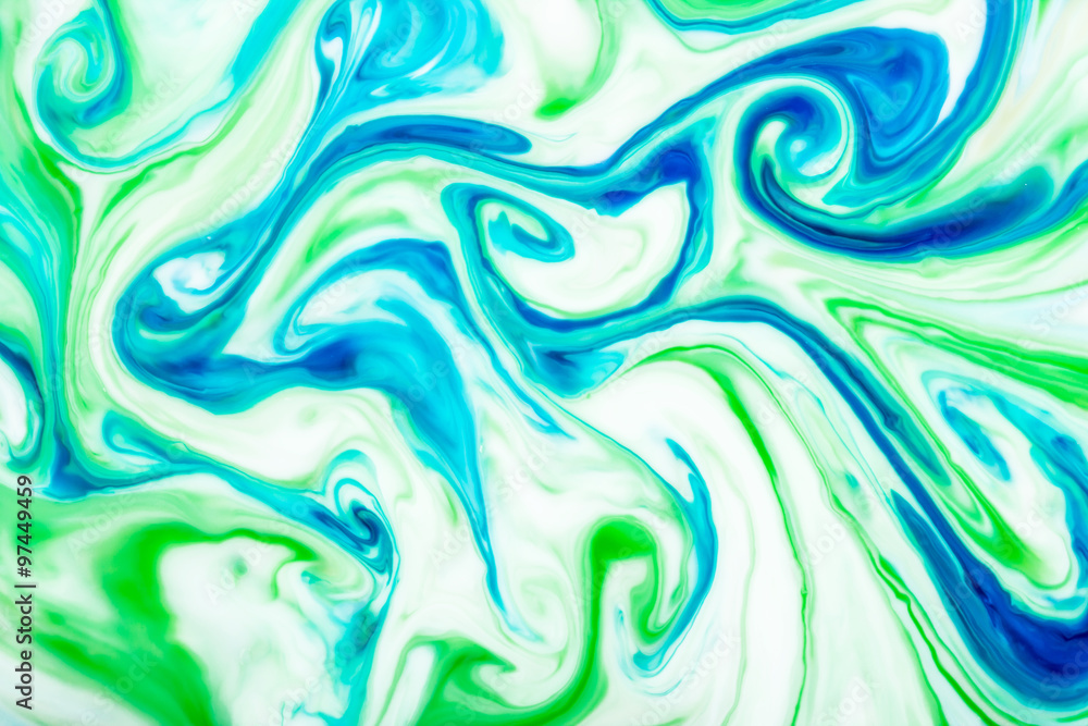Blue and green ink flowing in milk texture. Blue and green ink flowing in milk texture.