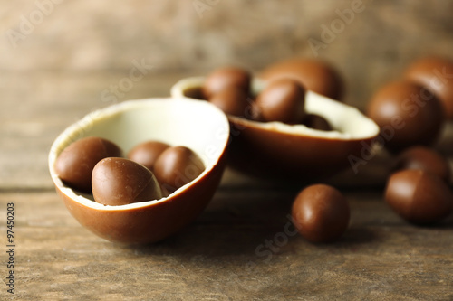 Chocolate Easter eggs on wooden background