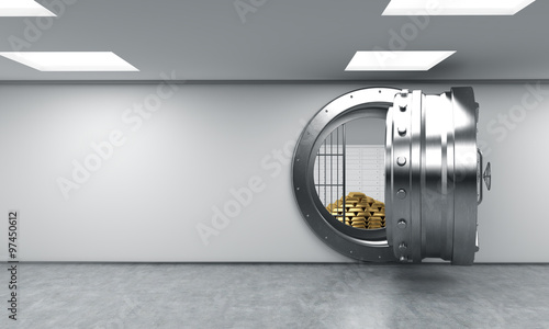 Fotografie open round metal safe with gold bars inside, bank depository