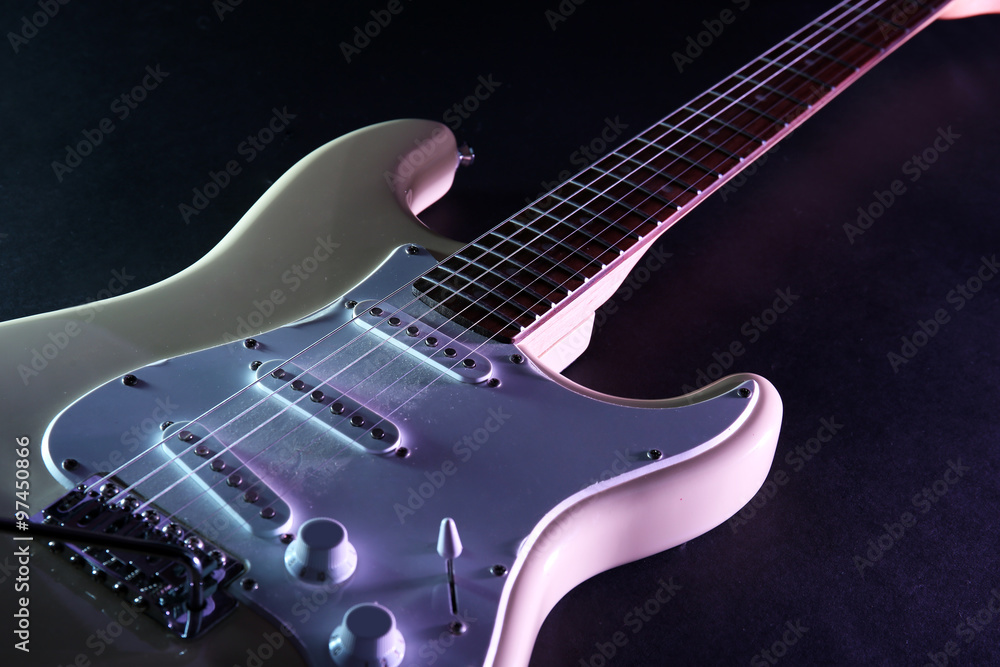 Electric guitar, on dark lighted background Electric guitar, on dark lighted background
