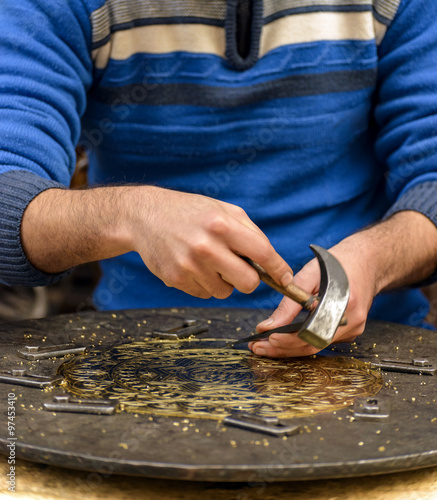 Hands of Craftsman Engraving Brass Plate