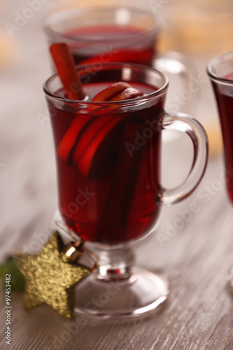 Mulled wine on wooden table, close-up