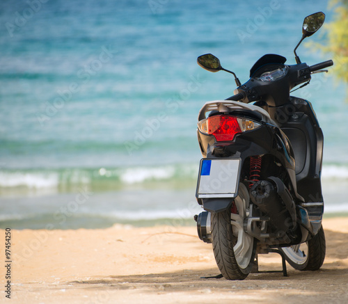 Scooter on the beach. Vacation concept.