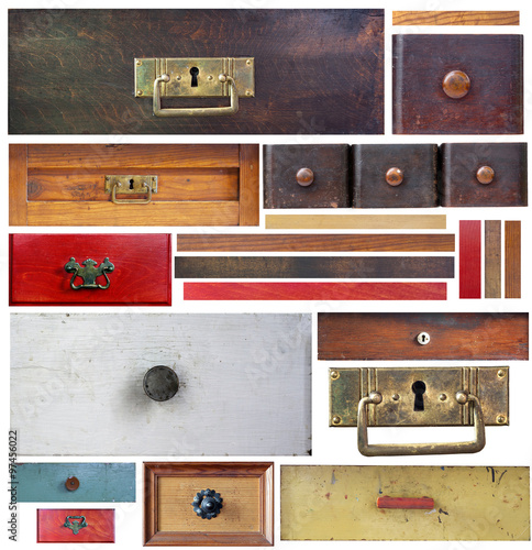 Old drawers, wooden strips and escutcheons on white background photo