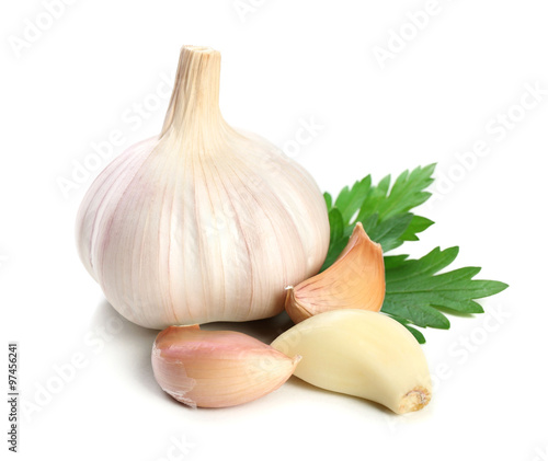 Garlic with leaves of parsley isolated on white