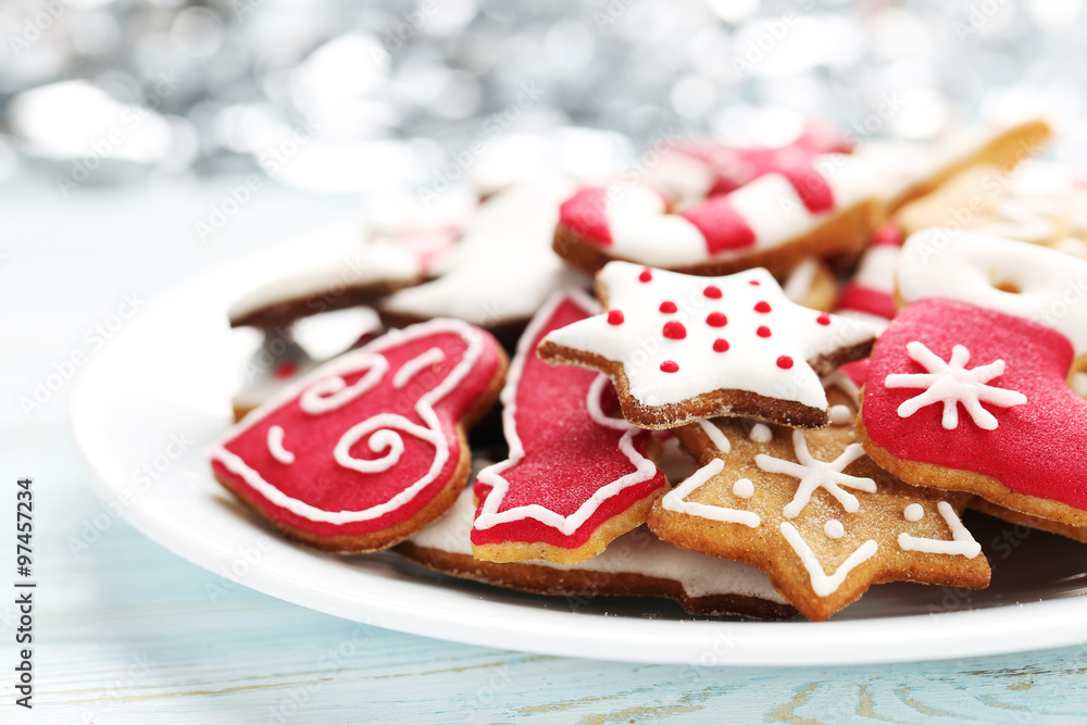 Christmas cookies in plate on a blue wooden table