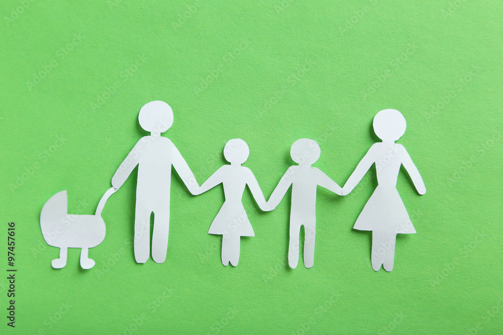 Happy paper family on green background Happy paper family on green background