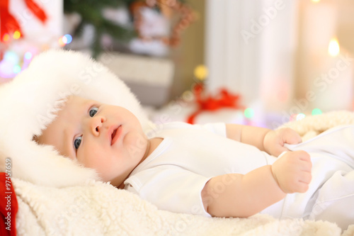 Cute baby in red hat on the...