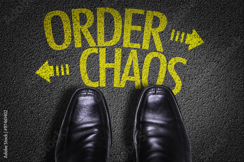 Top View of Business Shoes on the floor with the text: Order - Chaos photo