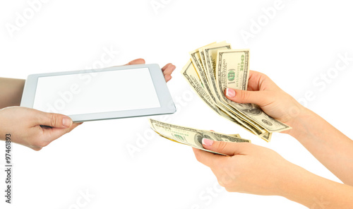 Tablet PC and money on hands- pawnshop concept photo