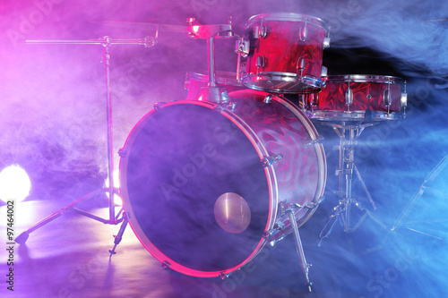 Drum set in smoke on a stage