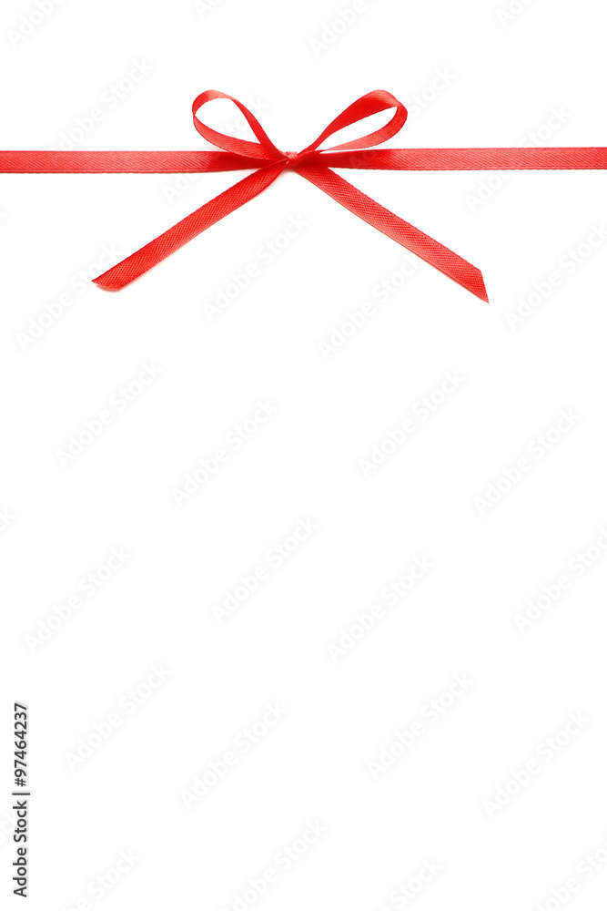 Shiny red ribbon with bow isolated on white Shiny red ribbon with bow isolated on white