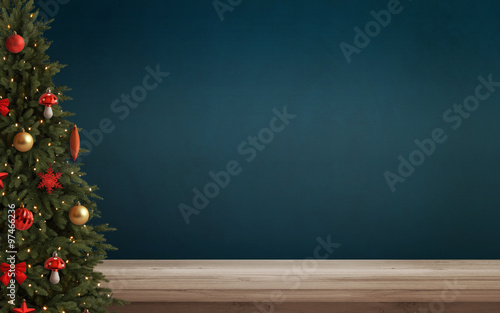 Christmas tree with decorations. Table and wall free space in background. photo