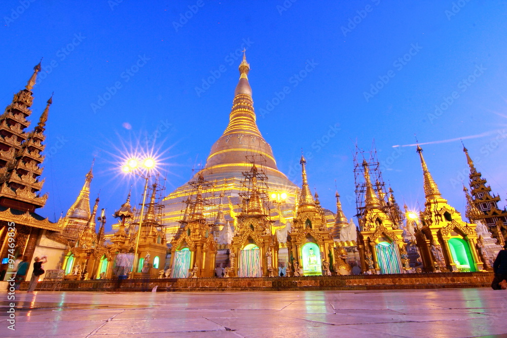 Fototapeta premium The Shwedagon Pagoda also known as the Great Dagon Pagoda and the Golden Pagoda, is a gilded stupa located in Yangon, Myanmar in twilight time