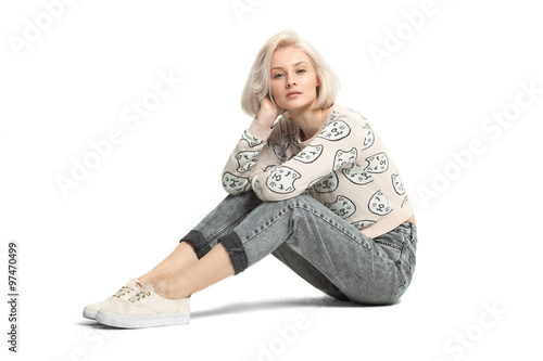 fashion female model sitting on floor isolated on white bakckground photo