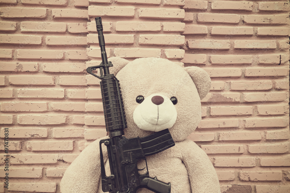 Teddy bear with toy gun Stock Photo Adobe Stock